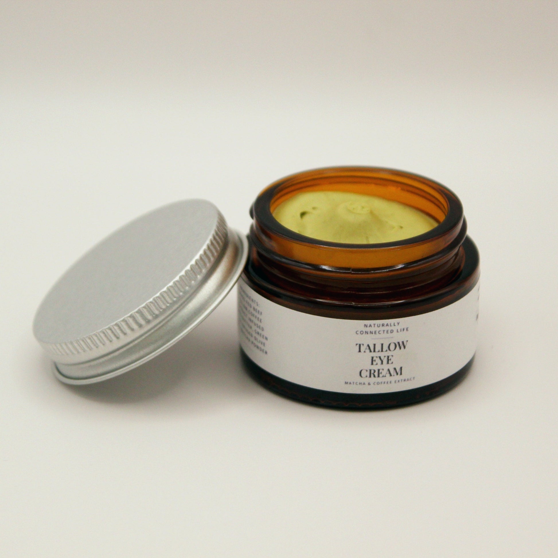 Jar of grass-fed beef tallow eye cream for dark circles and puffy eyes