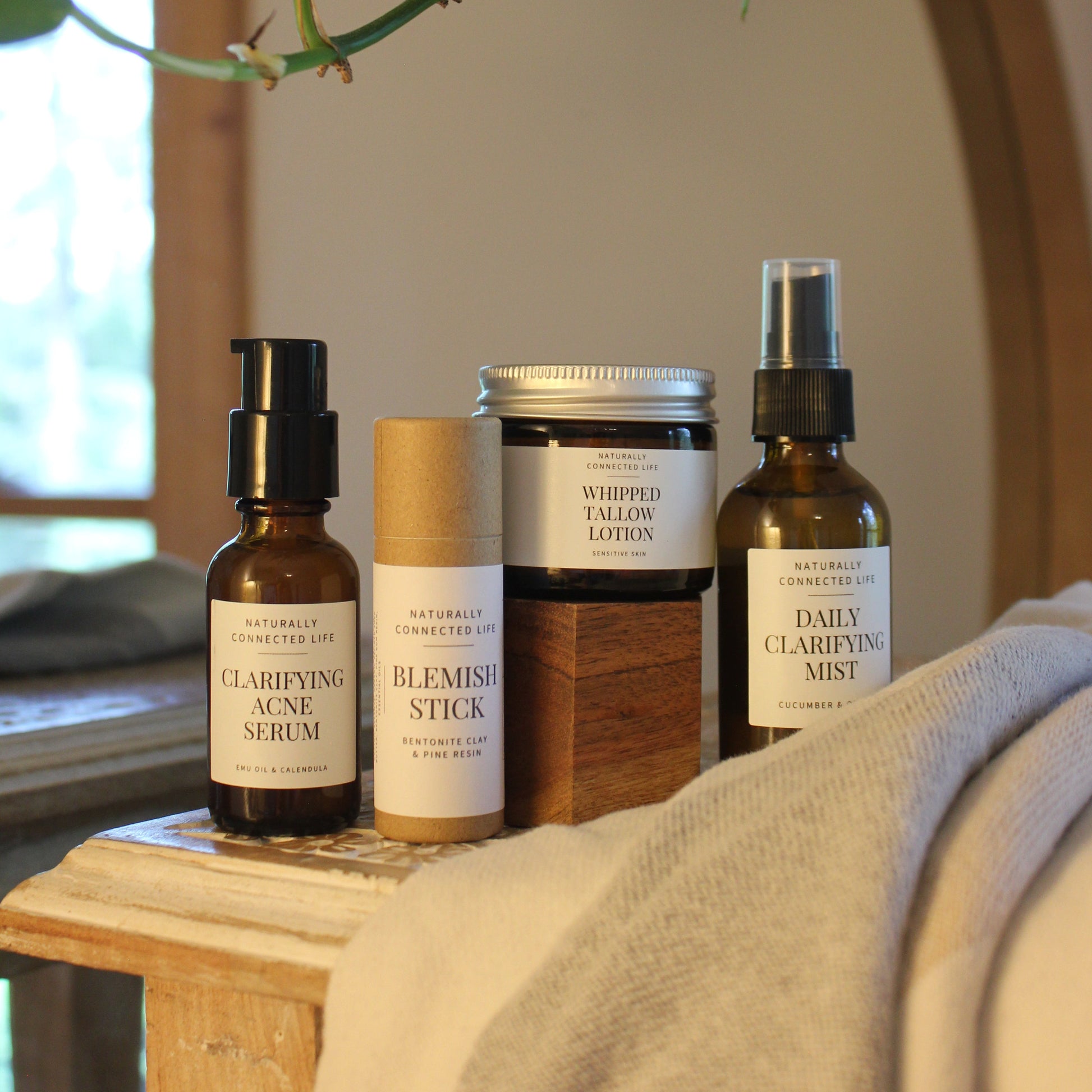 Naturally Connected Life's ultimate acne bundle with natural solutions to acne, daily clarifying mist, whipped tallow lotion for sensitive skin, blemish stick, clarifying acne serum, tallow skincare plastic free